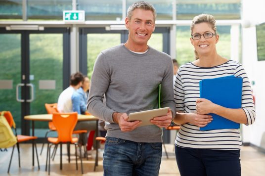 man and woman helping with device turn in man and woman helping with device turn in